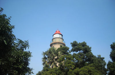 Low angle view of building against clear blue sky