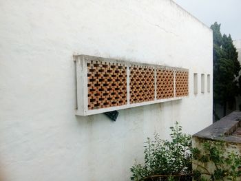 Low angle view of window on wall of building