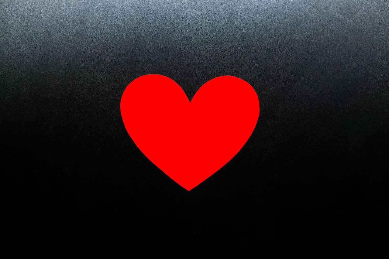 CLOSE-UP OF HEART SHAPE AGAINST BLACK BACKGROUND