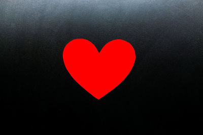 Close-up of heart shape on black background