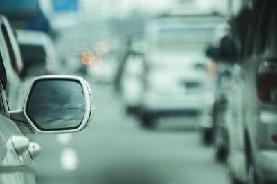 Reflection of car on side-view mirror