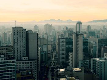 High angle view of buildings against sky during sunset