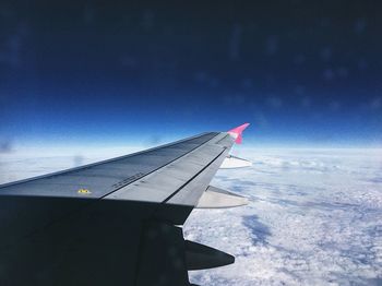 Airplane wing against sky