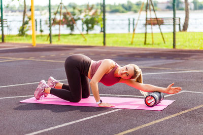 Side view of woman exercising outdoors