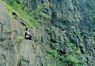 Man hiking on cliff