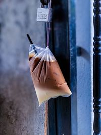 Close-up of ice cream hanging on pole