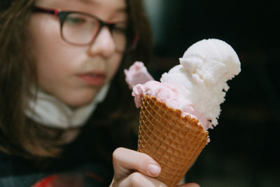 Close-up of child eating ice cream