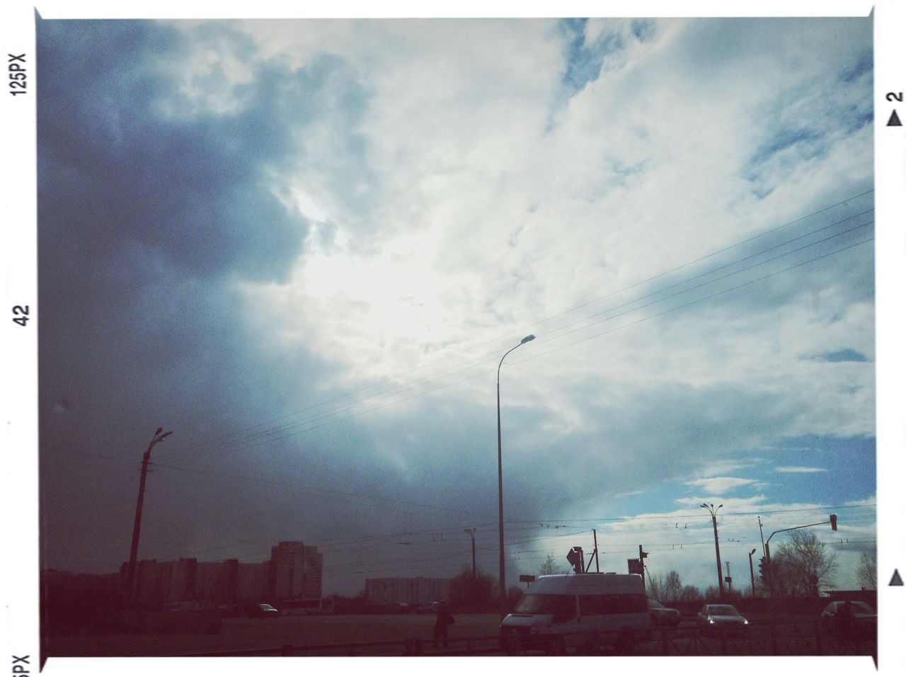 transfer print, auto post production filter, sky, building exterior, architecture, built structure, cloud - sky, low angle view, weather, cloudy, cloud, city, outdoors, day, nature, no people, building, sunlight, winter, cold temperature