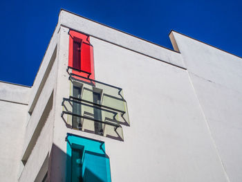 Low angle view of building against blue sky