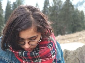 Close-up of young woman in eyeglasses