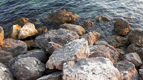 High angle view of rocks in sea