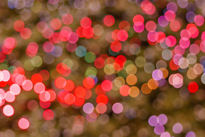 Defocused image of illuminated lights at night