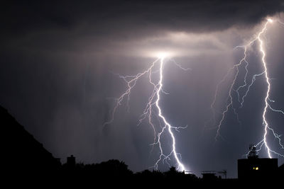 Low angle view of lightning in sky at night