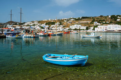 Boats moored at harbor