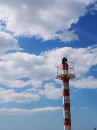 Low angle view of communications tower against sky