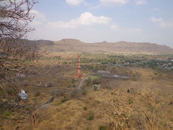 Scenic view of mountains against cloudy sky