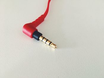 High angle view of camera on table against white background