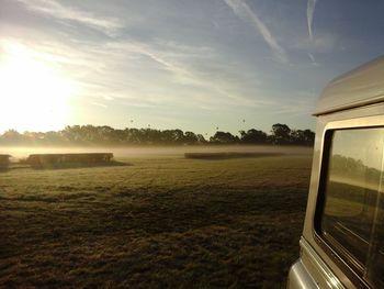 Scenic view of field against sky during sunset