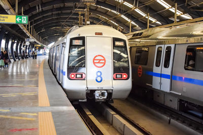 Delhi metro train arriving at jhandewalan metro station in new delhi, india, asia, public metro