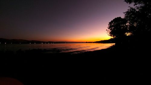 Scenic view of sea against clear sky during sunset