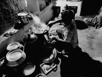High angle view of man cooking food at home