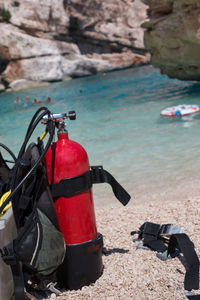 Motorcycle on rock by sea shore