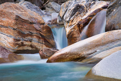 Scenic view of waterfall val verzasca