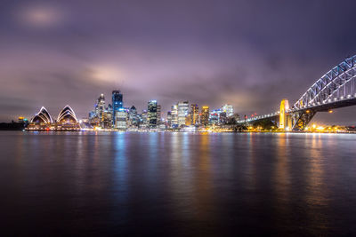 Illuminated city at waterfront