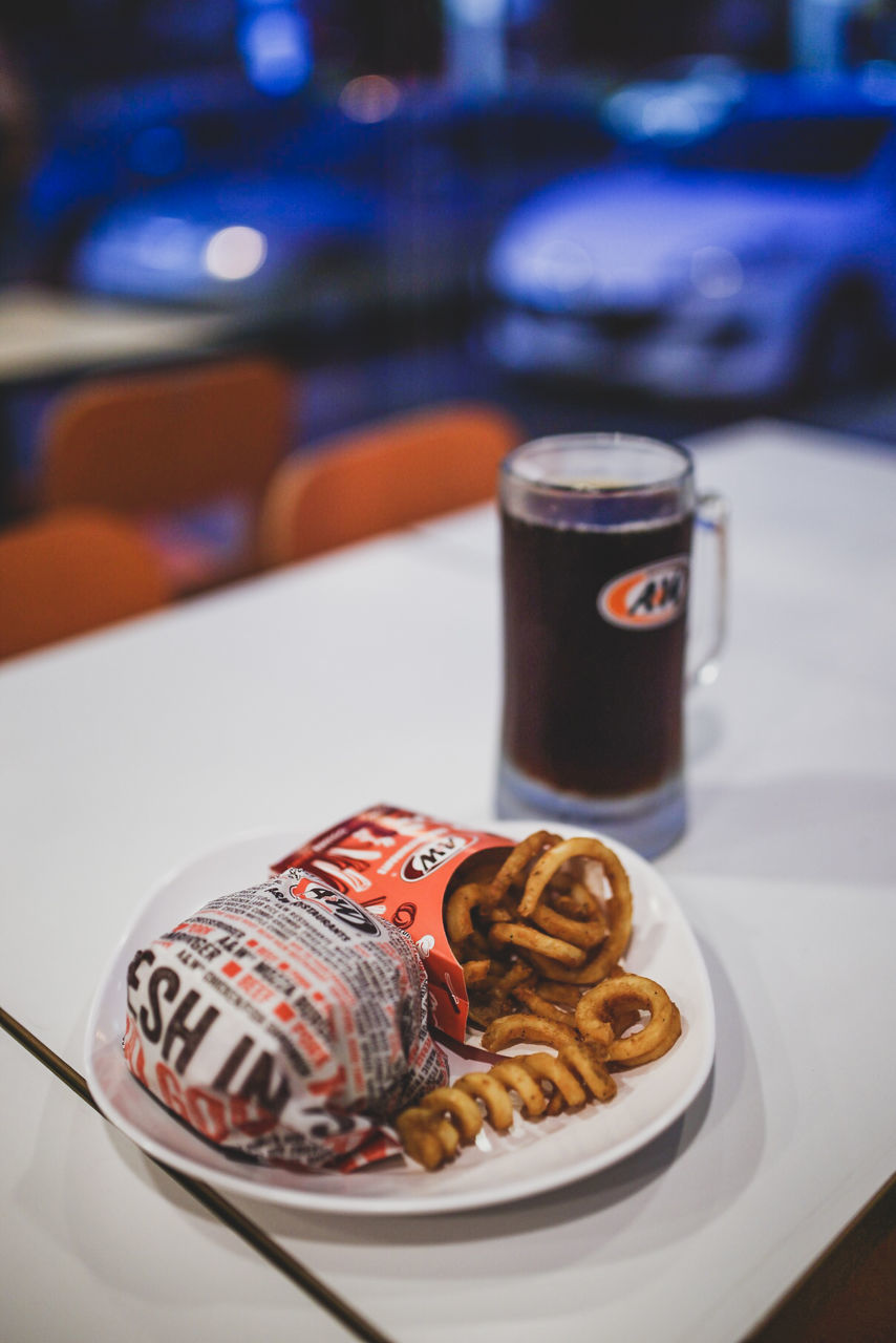 table, food and drink, drink, plate, no people, food, still life, refreshment, focus on foreground, close-up, indoors, baked, cup, freshness, ready-to-eat, sweet food, serving size, beer - alcohol, mug, cookie, glass, snack