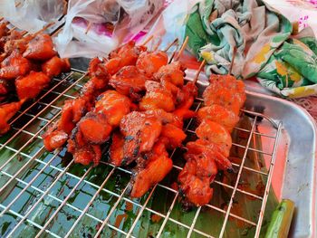 High angle view of meat on barbecue grill