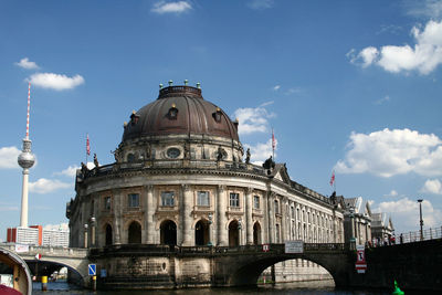 View of buildings against cloudy sky