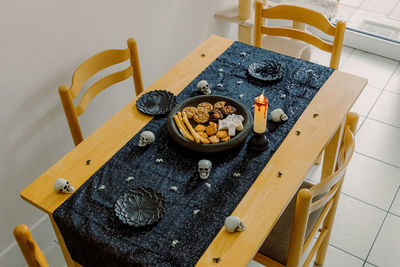 Set table for halloween in the kitchen.