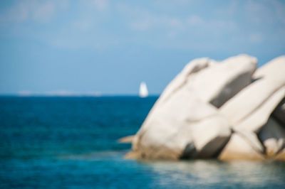 Close-up of sea against blue sky