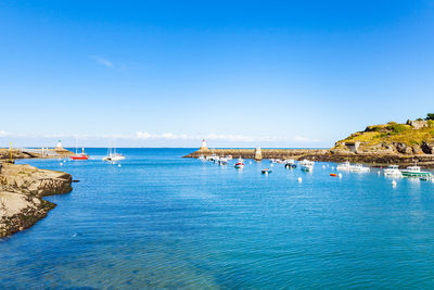 Scenic view of sea against clear blue sky