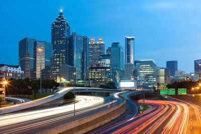 Light trails on road in city at night