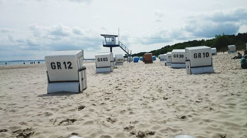 View of beach against cloudy sky