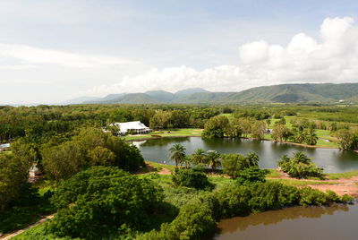 Scenic view of lake and trees against sky