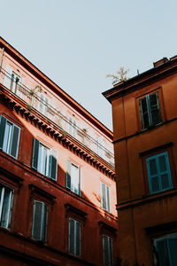 Low angle view of buildings against clear sky