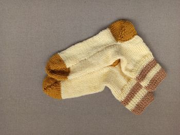 High angle view of stuffed toy over white background