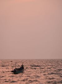 Scenic view of sea against clear sky during sunset