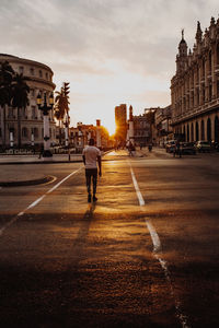 Man walking on road in city