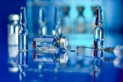 Close-up of wine glass against blue background