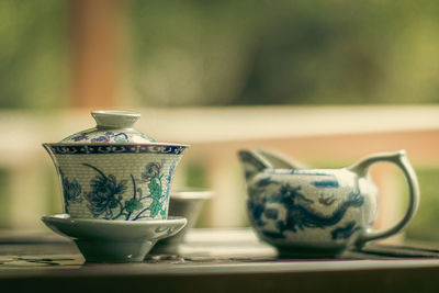 Close-up of a gaiwan and a teapot on a table somewhere in guangxi