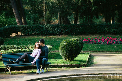 Full length of young couple in garden