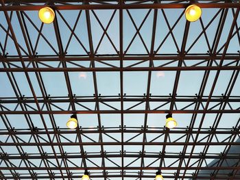 Low angle view of illuminated lights hanging on ceiling