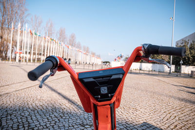 Rear view of woman on street against clear sky