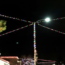 Low angle view of illuminated lights at night