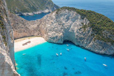 High angle view of rock formations by sea