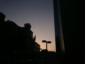 Illuminated building against sky