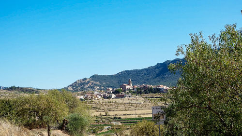 Scenic view of landscape against clear blue sky